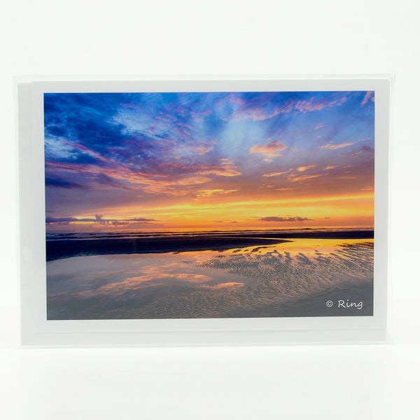Early morning sunrise over the ocean sea photograph on a greeting card