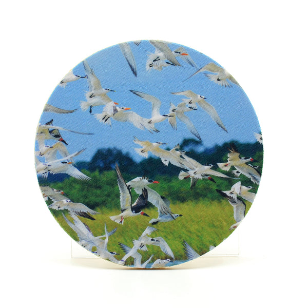 A flock of birds photograph on a round rubber home coaster