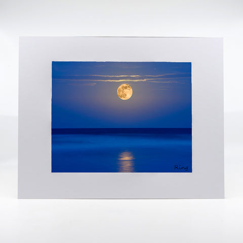 A super moon rising over the ocean sea photography artwork