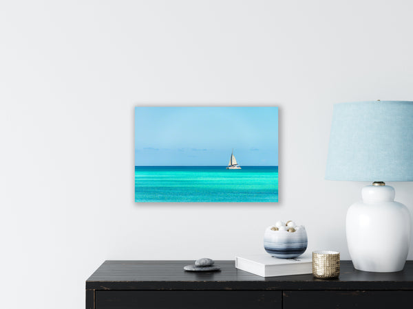 A sailboat taking tourists for a peaceful ride  Photograph
