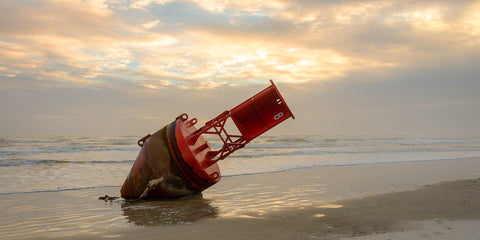 A photo of a Red Buoy that washed ashore in New Smyrna Beach
