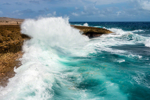 A photo of large crashing waves along the rocky windward coast on the island of Curacao