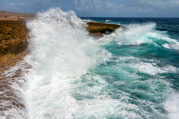 A photo of large crashing waves along the rocky windward coast on the island of Curacao
