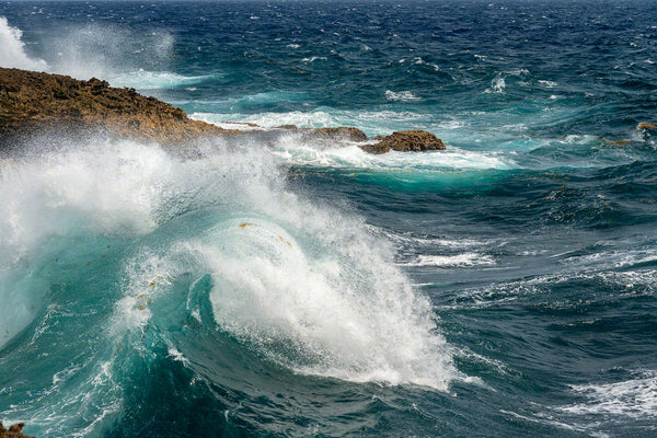A photo of large crashing waves along the rocky windward coast on the island of Curacao