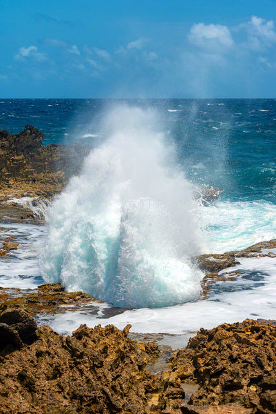 A photo of large crashing waves along the rocky windward coast on the island of Curacao