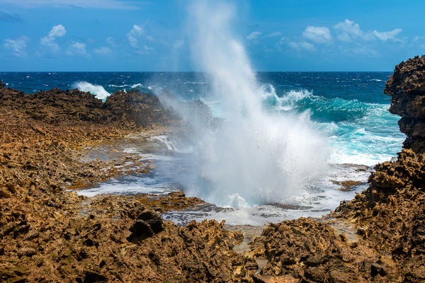 A photo of large crashing waves along the rocky windward coast on the island of Curacao