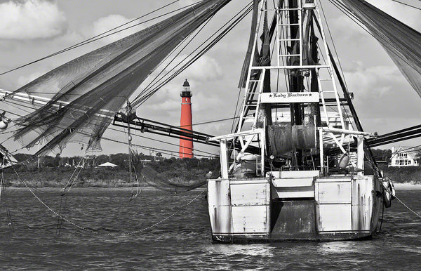 A photo of the Ponce Inlet Lighthouse and Lady Barbara shrimp boat