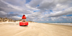 A panoramic photograph by Mike Ring of a lost red buoy on Cumberland Island, Georgia.