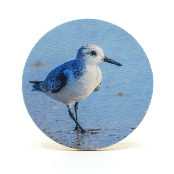 Sanderling on the beach photograph on a round rubber home coaster