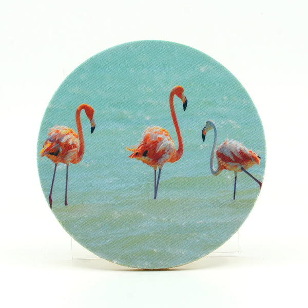 A flock of flamingos in a salt pan in the Caribbean photograph on a round rubber home coaster