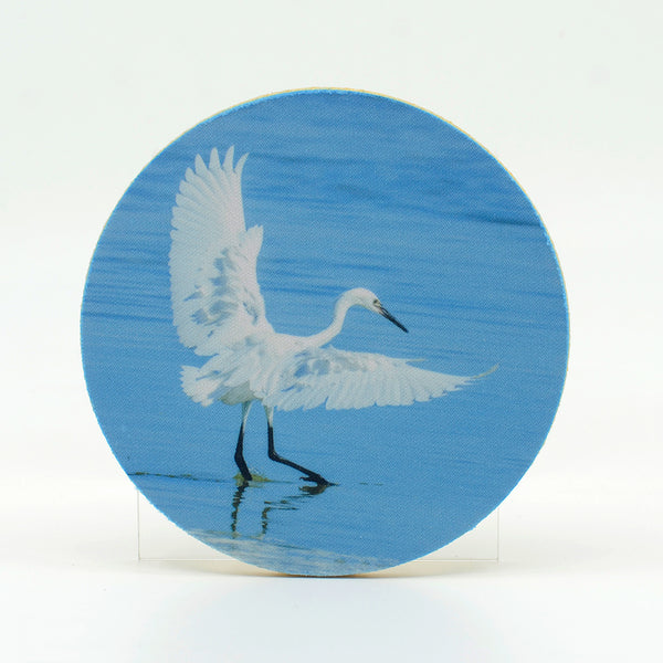 A morph reddish egret photograph on a round rubber home coaster