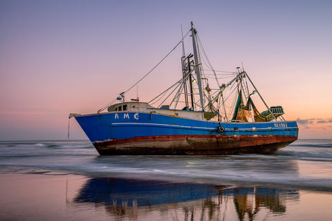 A photo of a beached shrimp boat