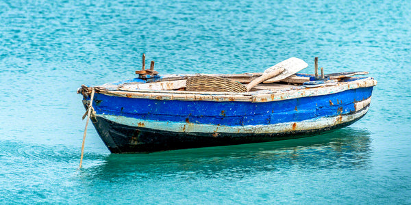 A photo of a blue Haitian fisherman's boat in the Caribbean