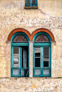 A photo of old turquoise colored shutters in Havana, Cuba