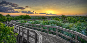 A sunrise at Lighthouse Point Park boardwalk to the beach