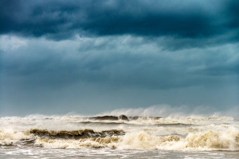 A photograph of huge surf and dark sky from Hurricane Dorian by Mike Ring