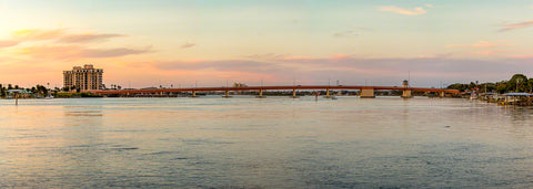A panoramic sunset view of the North Causeway bridge in New Smyrna Beach, Florida