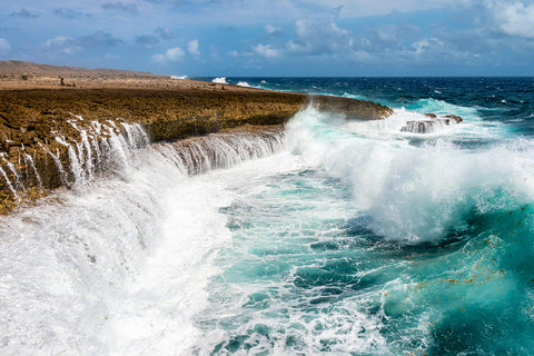 A photo of large crashing waves along the rocky windward coast on the island of Curacao