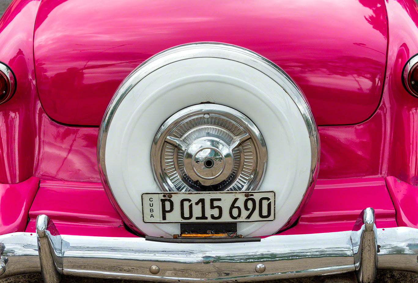 A pink classic American car used as a taxi in Havana Cuba