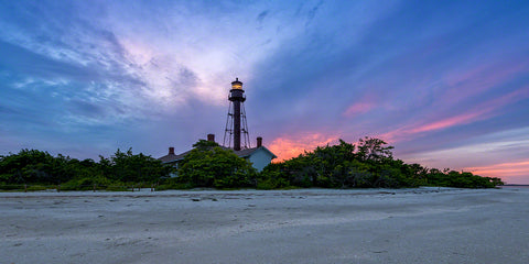 A landscape photograph by Mike Ring of the Sanibel Lighthouse at sunset