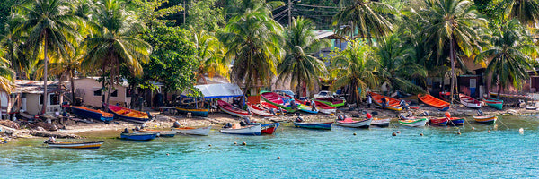 A panoramic photograph of numerous boats at a fishing village in the town of Castries, St. Lucia
