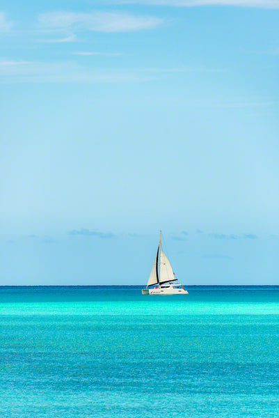 A sailboat taking tourists for a peaceful ride along the coast in Antigua
