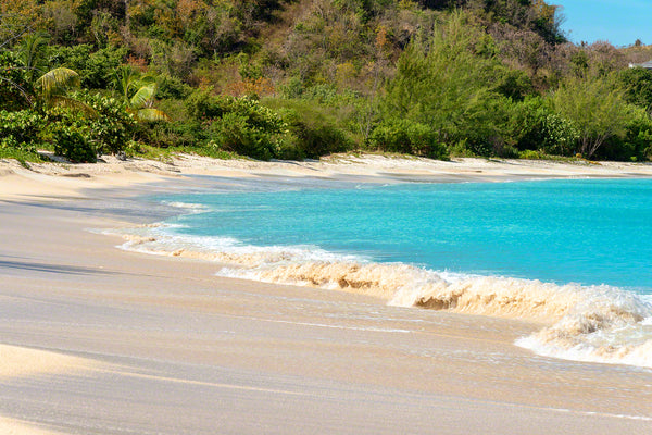 A photo of the surf and sand at beautiful Valley Church Beach in Antigua